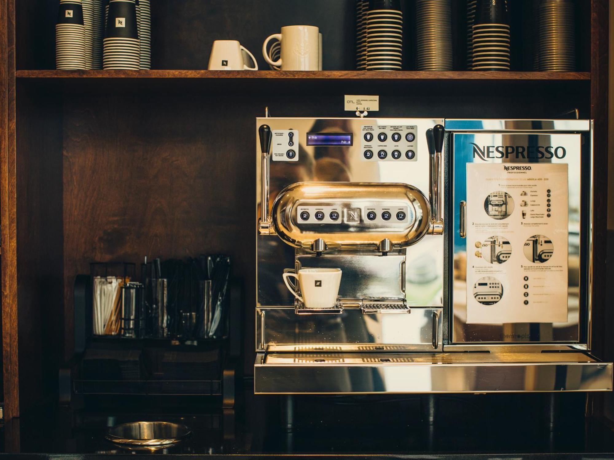 Otl Gouverneur Saguenay Exterior foto A Nespresso machine